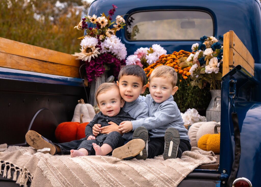 fall apple orchard on a little blue truck